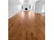 Bright living room with hardwood floors, a fireplace, and double doors leading to another room at 5413 Avenida Caballo, Las Vegas, NV 89108