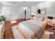 Serene main bedroom featuring natural light, neutral decor, hardwood floors, and a double-door closet at 5413 Avenida Caballo, Las Vegas, NV 89108