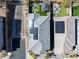 Aerial shot of a house showing the roof with solar panels, and well-maintained backyard with a patio and fire pit at 59 Strada Loreto, Henderson, NV 89011