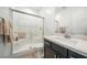 Modern bathroom with a glass-enclosed shower, stylish vanity, and neutral color palette at 59 Strada Loreto, Henderson, NV 89011