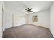 Relaxing bedroom featuring neutral carpet, a ceiling fan, and natural light at 59 Strada Loreto, Henderson, NV 89011