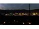 Night shot of the Las Vegas skyline at night with mountains in the background at 59 Strada Loreto, Henderson, NV 89011