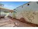 View of a covered back patio with a well maintained fence and landscaping at 6190 Tillman Crest Ave, Las Vegas, NV 89139