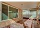 View of a covered back patio, a security screen door, and adjacent window at 6190 Tillman Crest Ave, Las Vegas, NV 89139