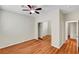 Bedroom featuring wood-look floors, sliding closet and neutral walls at 6190 Tillman Crest Ave, Las Vegas, NV 89139