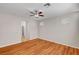 Bright bedroom with hardwood floor, ceiling fan, and an ensuite bathroom at 6190 Tillman Crest Ave, Las Vegas, NV 89139