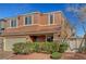 Two-story home with a neutral-toned exterior, a two-car garage, and manicured landscaping at 6190 Tillman Crest Ave, Las Vegas, NV 89139