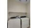 Functional laundry room with washer, dryer, and a convenient overhead shelf at 6190 Tillman Crest Ave, Las Vegas, NV 89139