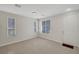 Inviting living room with tile flooring, bright natural light, and neutral walls at 6190 Tillman Crest Ave, Las Vegas, NV 89139