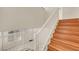 Wood staircase with white banister featuring a window landing and white entry door view at 6190 Tillman Crest Ave, Las Vegas, NV 89139