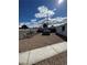 Gravel backyard featuring lounge chairs and a hot tub surrounded by a block fence at 621 S 9Th St, Las Vegas, NV 89101