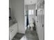 Bright bathroom featuring a glass enclosed shower, toilet, sink, and wood-look flooring at 621 S 9Th St, Las Vegas, NV 89101