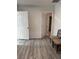 Bright bedroom featuring neutral paint and wood-look flooring, and two seating chairs at 621 S 9Th St, Las Vegas, NV 89101