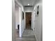 Bright hallway with neutral paint and wood-look flooring, leading to various rooms at 621 S 9Th St, Las Vegas, NV 89101