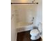 This bathroom features a shower over tub combo with tiled walls at 6320 Tier Ave, Las Vegas, NV 89139