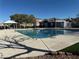 Beautiful community pool and clubhouse on a sunny day, perfect for recreation and relaxation at 6320 Tier Ave, Las Vegas, NV 89139