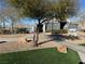 Exterior view of community clubhouse with playground and pool in background at 6320 Tier Ave, Las Vegas, NV 89139