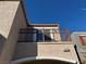 Low angle exterior view of the home and its balcony at 6320 Tier Ave, Las Vegas, NV 89139