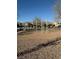 Outdoor fitness area with exercise bars and balance beam on a bed of gravel, promoting a healthy lifestyle at 6320 Tier Ave, Las Vegas, NV 89139