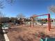 Community playground offers swings and climbing structures for of all ages at 6320 Tier Ave, Las Vegas, NV 89139