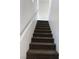 Carpeted stairs with white wall and banister at 6320 Tier Ave, Las Vegas, NV 89139