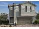 Two-story home featuring a two-car garage and neutral-colored stucco exterior at 6604 Tumoulin St, Las Vegas, NV 89148