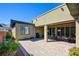 Spacious backyard patio with brick paving, covered seating area, and low-maintenance landscaping at 6722 Desert Crimson St, Las Vegas, NV 89148