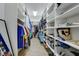 Spacious walk-in closet featuring custom shelving and ample storage space for an organized wardrobe at 6722 Desert Crimson St, Las Vegas, NV 89148