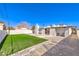 Private backyard showcases artificial turf, a concrete patio, and modern accents, a serene outdoor living space at 701 N Yale St, Las Vegas, NV 89107