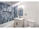 Well-lit bathroom showcasing blue vertical tiling and new fixtures at 701 N Yale St, Las Vegas, NV 89107