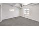 This bedroom features a ceiling fan, carpet, and bright natural light at 701 N Yale St, Las Vegas, NV 89107