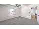 This bedroom features a ceiling fan, carpet, and bright natural light at 701 N Yale St, Las Vegas, NV 89107