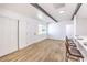 Bright living room boasts wood floors, white walls, and modern design with wood beam accents at 701 N Yale St, Las Vegas, NV 89107