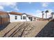 This home features a backyard with a patio and desert landscaping for minimal upkeep at 7505 Crystal Clear Ave, Las Vegas, NV 89113