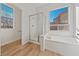 Bright bathroom features a separate shower and tub with wood look flooring and natural light at 7505 Crystal Clear Ave, Las Vegas, NV 89113