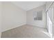 Bedroom featuring neutral carpet, closet, and a window for natural light at 7505 Crystal Clear Ave, Las Vegas, NV 89113