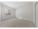 Bedroom featuring neutral carpet, white walls, closet, and a window at 7505 Crystal Clear Ave, Las Vegas, NV 89113