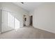 A bedroom has carpet, closet and a view to the ensuite at 7505 Crystal Clear Ave, Las Vegas, NV 89113