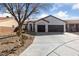 Charming single-story home with a tile roof, stucco exterior, and a spacious two-car garage at 7505 Crystal Clear Ave, Las Vegas, NV 89113