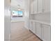 Butler's pantry with built-in cabinets provides ample storage space for kitchen essentials at 7505 Crystal Clear Ave, Las Vegas, NV 89113