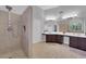 Accessible bathroom design featuring a walk-in shower and spacious countertops at 7632 Desert Largo Ave, Las Vegas, NV 89128