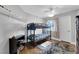 Cozy bedroom featuring a bunk bed, ceiling fan and natural light at 7632 Desert Largo Ave, Las Vegas, NV 89128