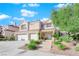 Charming two-story home featuring a two-car garage and a beautifully landscaped front yard at 7632 Desert Largo Ave, Las Vegas, NV 89128