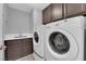 Well-equipped laundry room with matching washer and dryer, providing convenience and functionality at 7632 Desert Largo Ave, Las Vegas, NV 89128