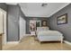 Cozy bedroom with gray walls, white trim, and hardwood floors at 801 Sir James Bridge Way, Las Vegas, NV 89145