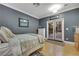 Bedroom features French doors to the backyard and neutral tones at 801 Sir James Bridge Way, Las Vegas, NV 89145