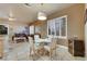 Cozy dining area with natural light filtering through the plantation shutters with easy access to the living room at 801 Sir James Bridge Way, Las Vegas, NV 89145