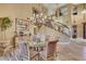 Bright dining space with a decorative chandelier and staircase, perfect for hosting memorable gatherings at 801 Sir James Bridge Way, Las Vegas, NV 89145