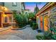 Charming entryway featuring stone accents, brick pavers, mature landscaping, and an inviting atmosphere perfect for any home at 801 Sir James Bridge Way, Las Vegas, NV 89145