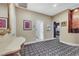 Hallway with decorative patterned carpet leading to the bathroom, laundry room and bedroom at 801 Sir James Bridge Way, Las Vegas, NV 89145